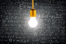 A picture of a light bulb with mathematical formulas in the background.